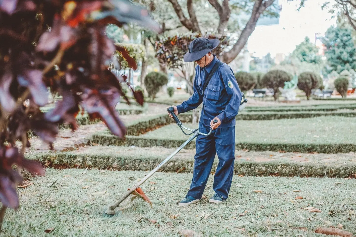 A Raise crew member maintaining ornamental beds